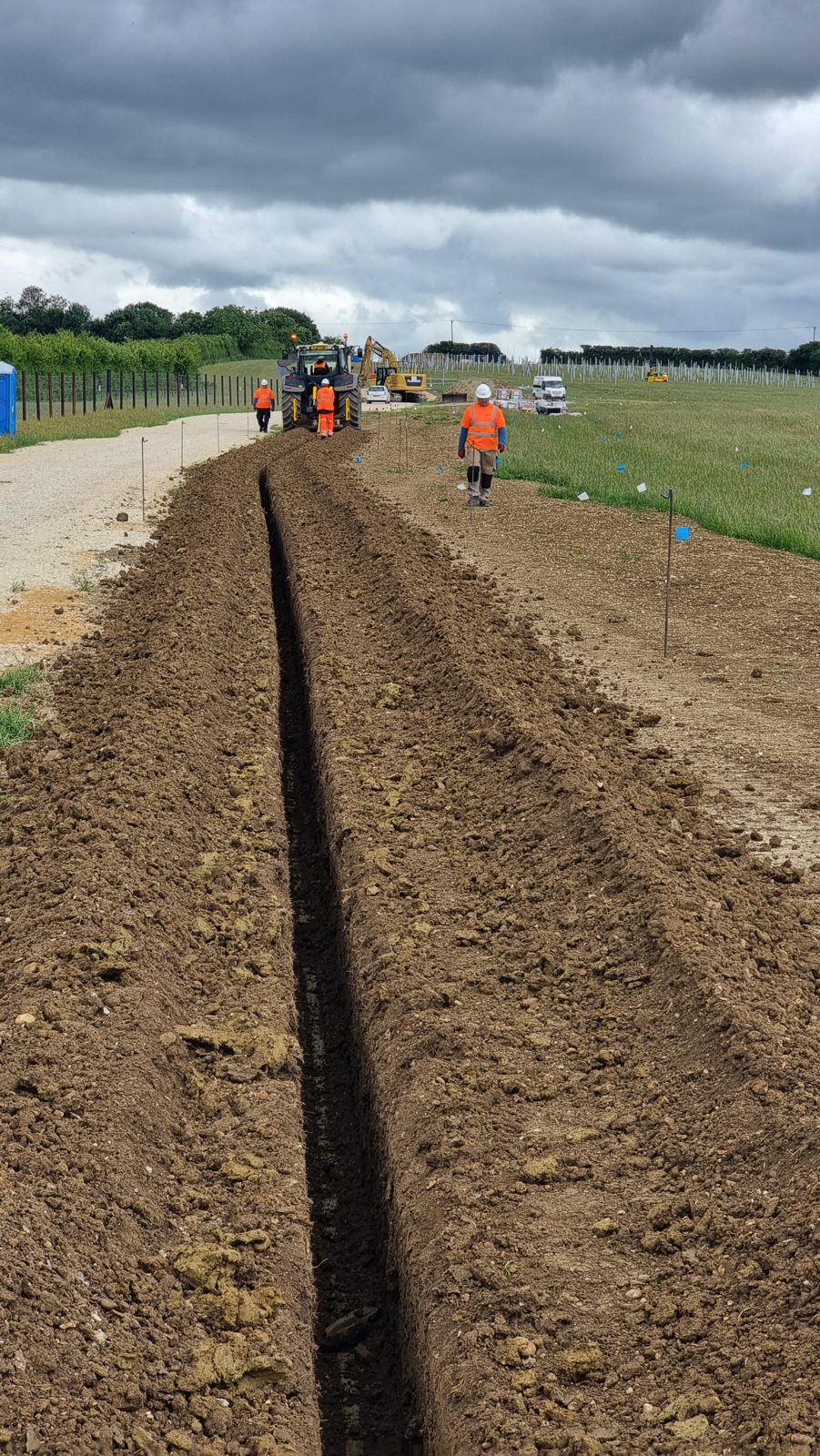 A cable trench running alongside an access roadway at a 29MW solar farm in Oxfordshire.