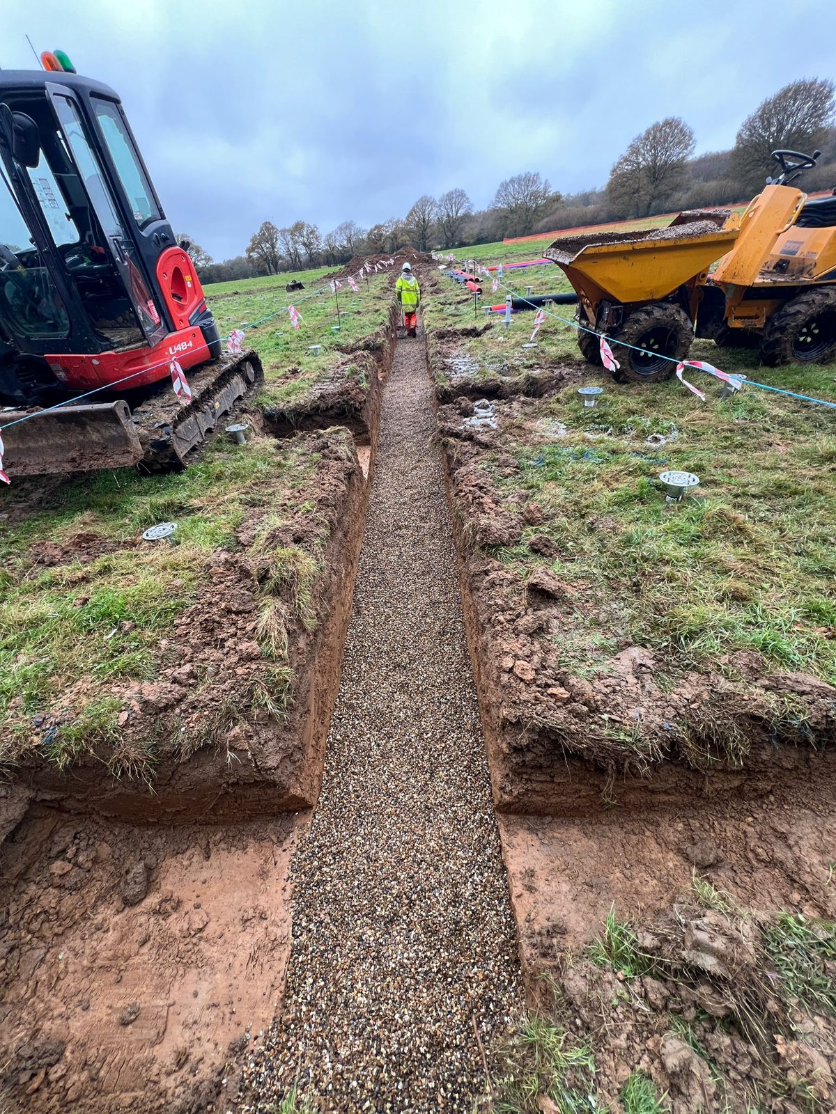 A cable trench with a gravel bed in East Sussex.