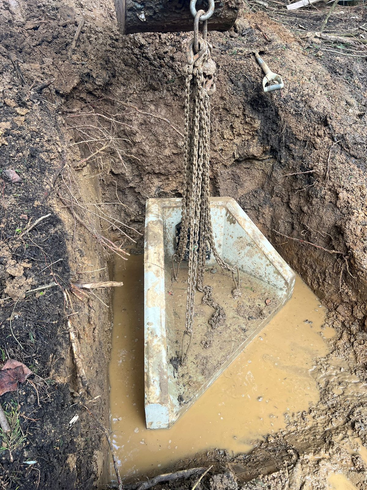 A concrete headwall being installed as a drainage outfall at a BESS and solar site in East Sussex.