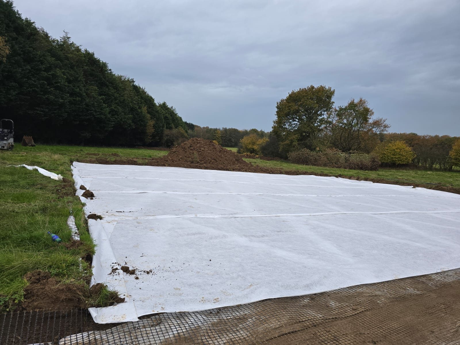 Geotextile membrane laid over a prepared formation.