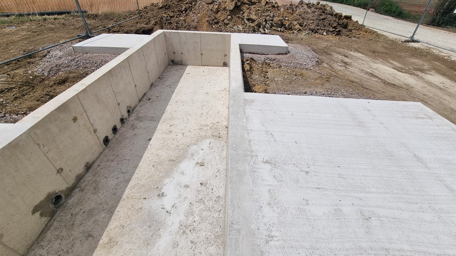 A finished reinforced concrete base with cast-in duct entries in Cambridgeshire.