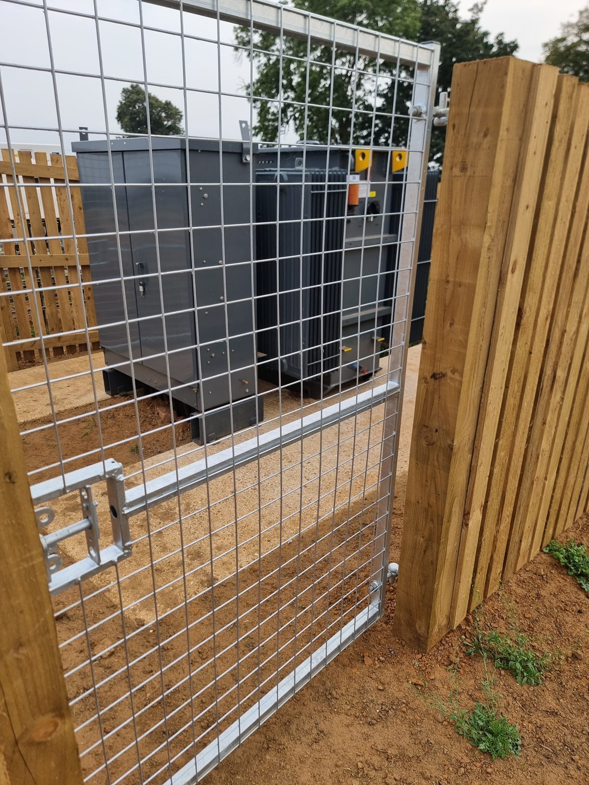A completed transformer and DNO compound behind security fencing in West Northamptonshire.